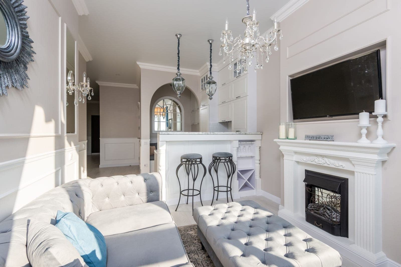 Flat-panel TV mounted flush in a recessed paneled alcove above a white fireplace mantel, every wire concealed — the over-fireplace finish ATX TV Mounting installs
